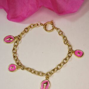 Bracelet doré et rose vif avec des breloques coquillage et étoile de mer. Bijou Sophia Célesta